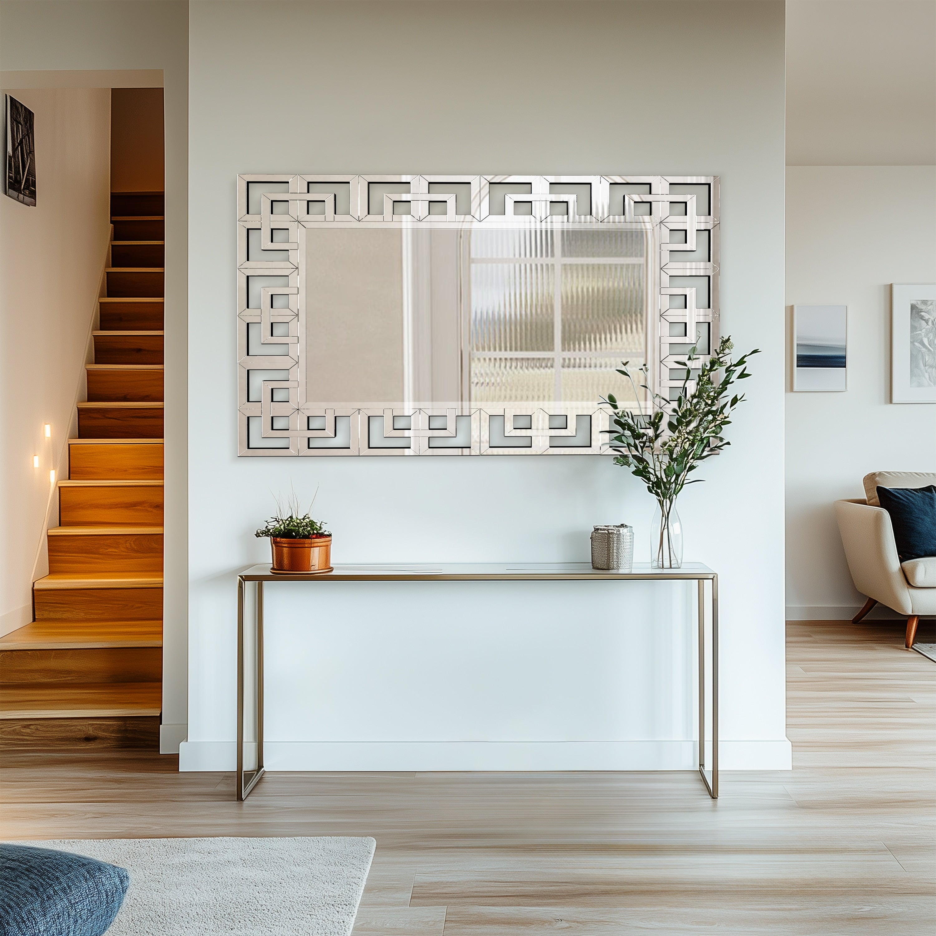 Grand miroir mural décoratif avec cadre géométrique aux accents argentés