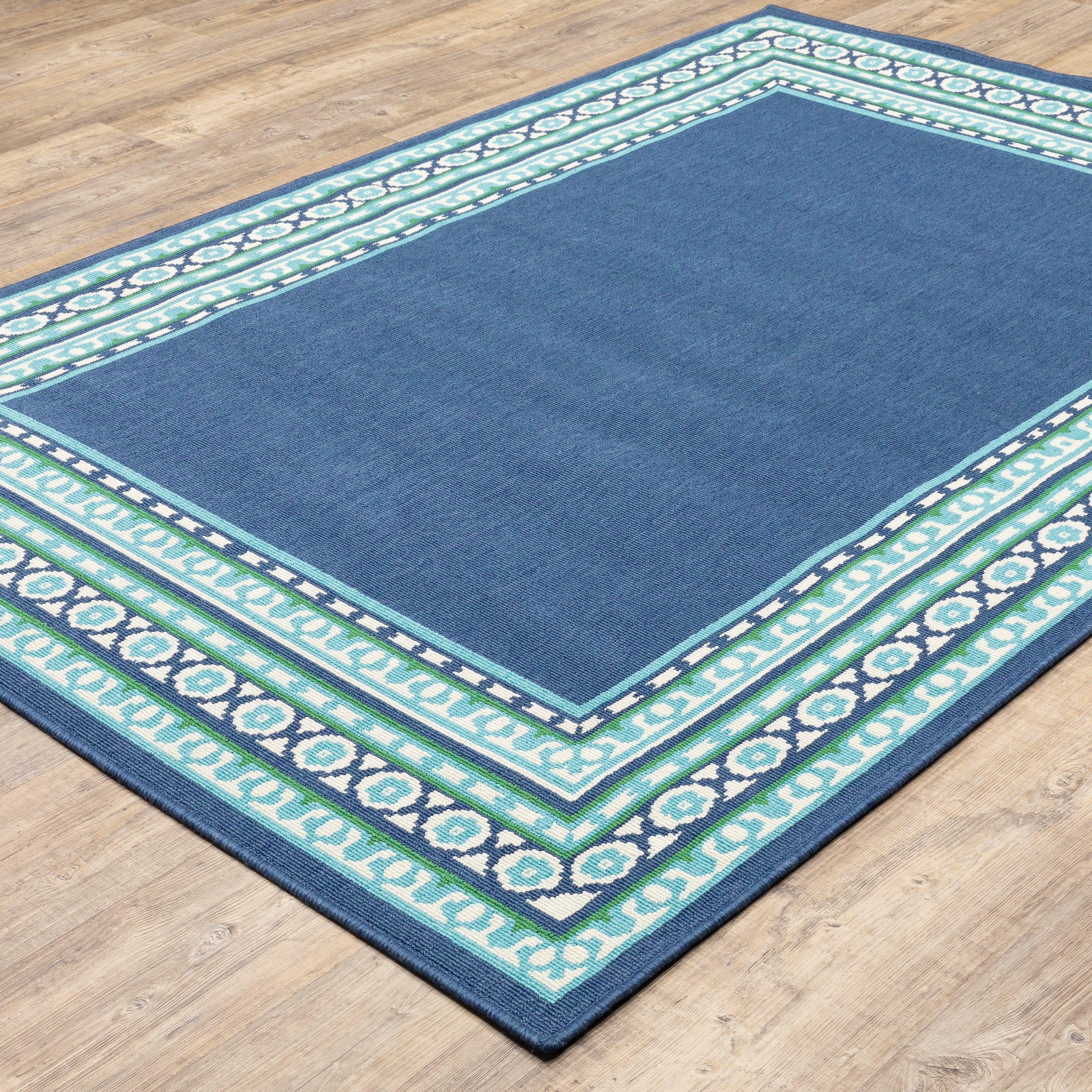 Tapis d'intérieur/extérieur Style Haven Martinque à bordure verte bleu marine ~