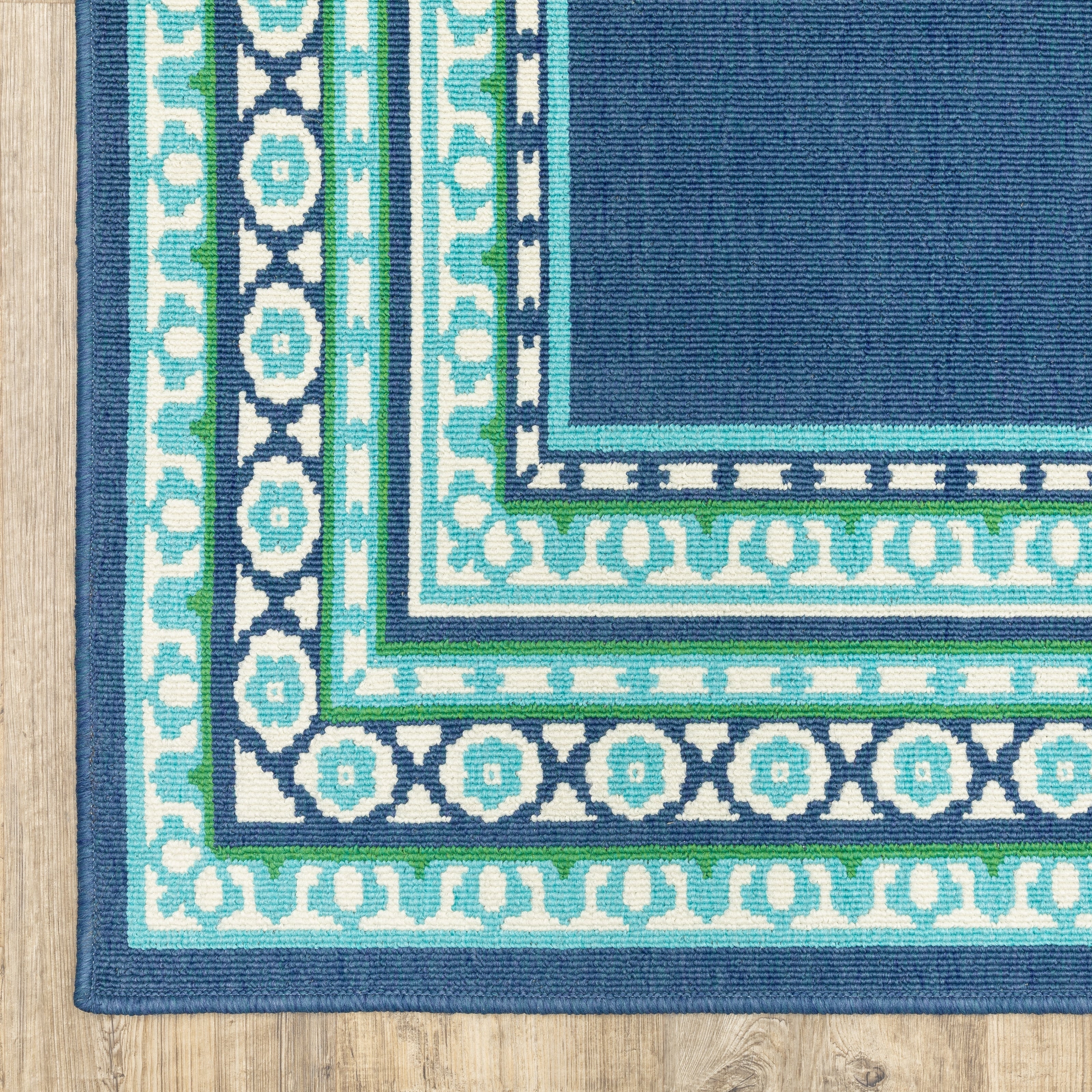 Tapis d'intérieur/extérieur Style Haven Martinque à bordure verte bleu marine ~
