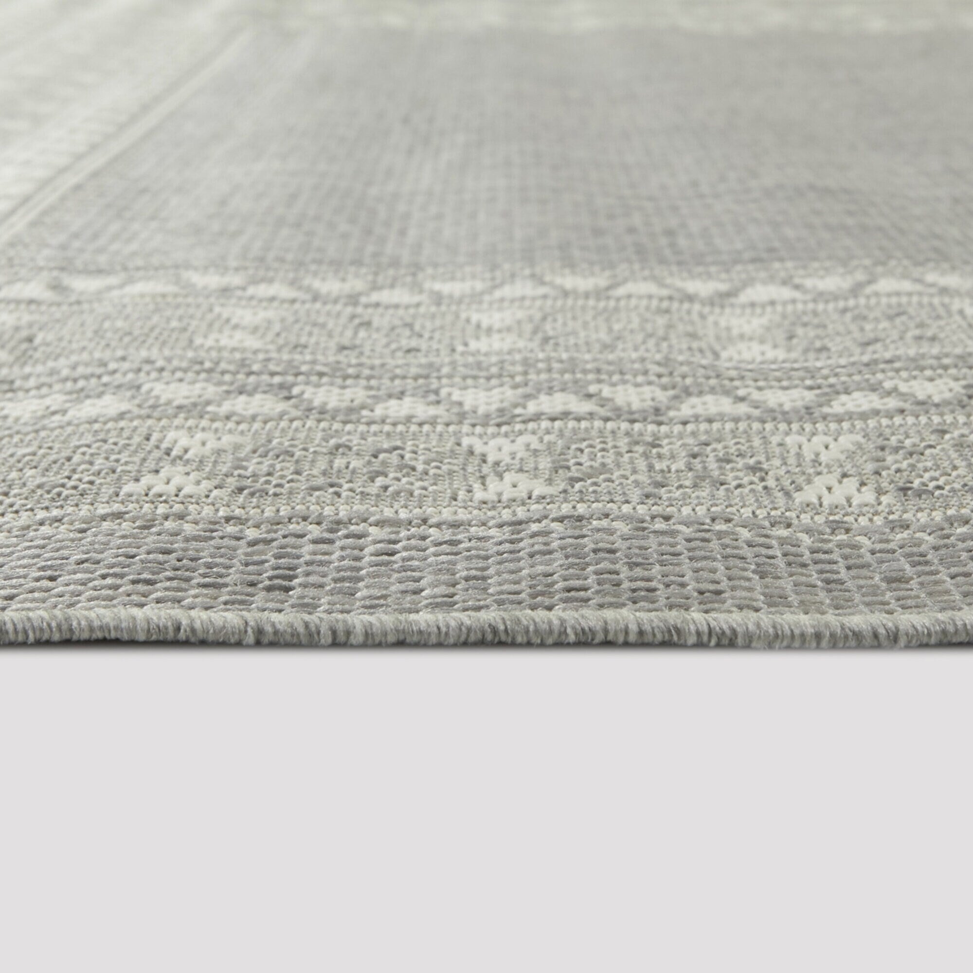 Tapis d'intérieur/extérieur à bordure transitionnelle Carew