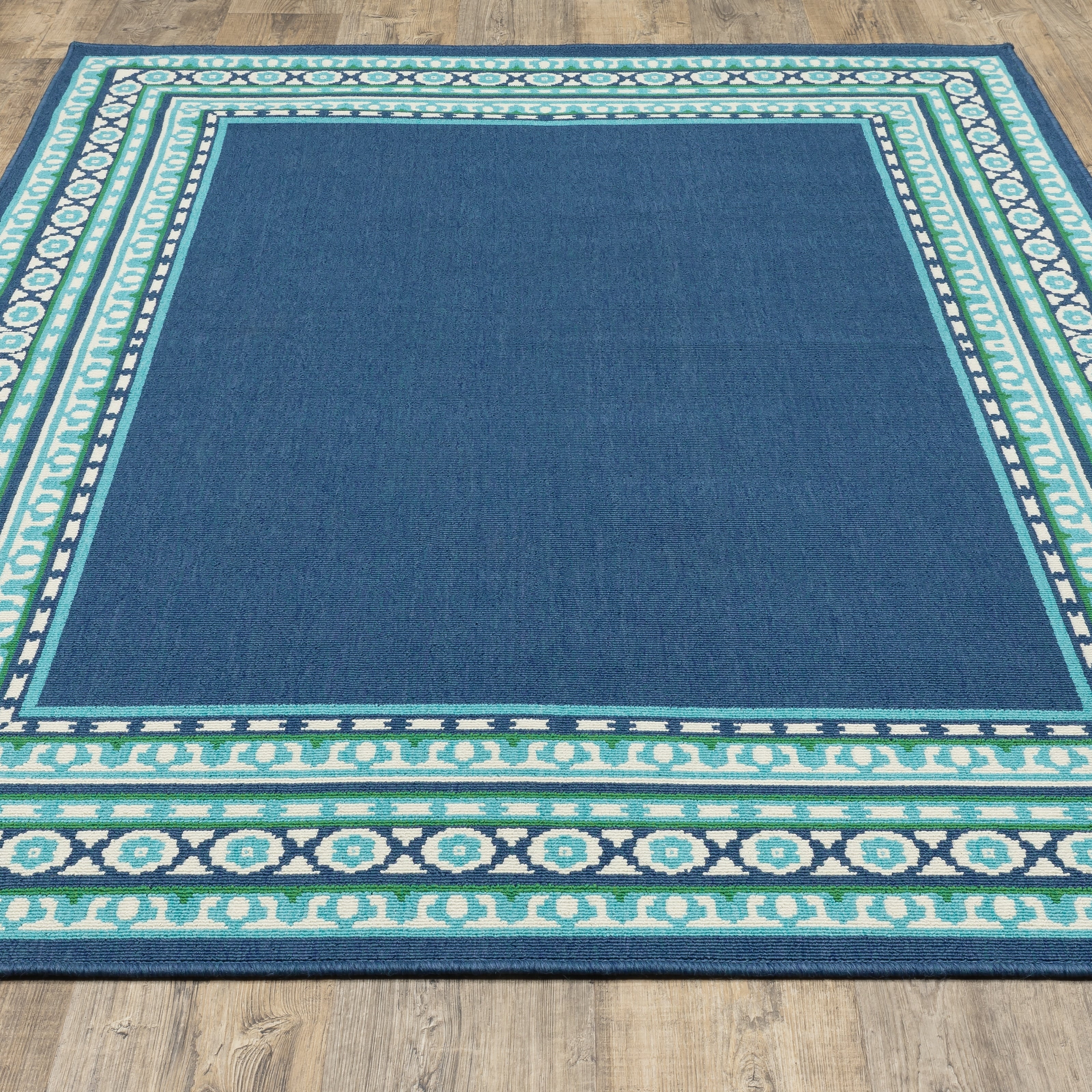 Tapis d'intérieur/extérieur Style Haven Martinque à bordure verte bleu marine ~